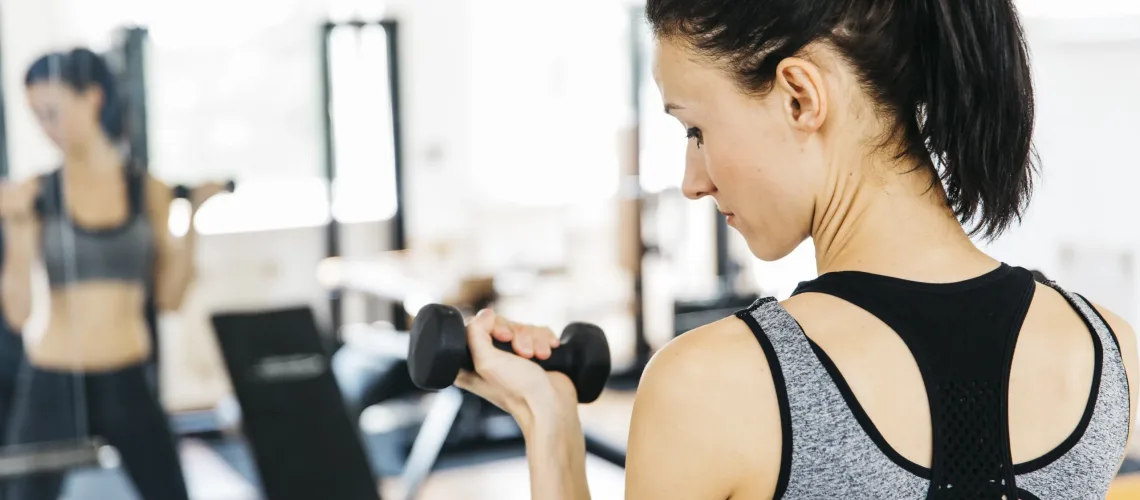 young-woman-working-out-gym